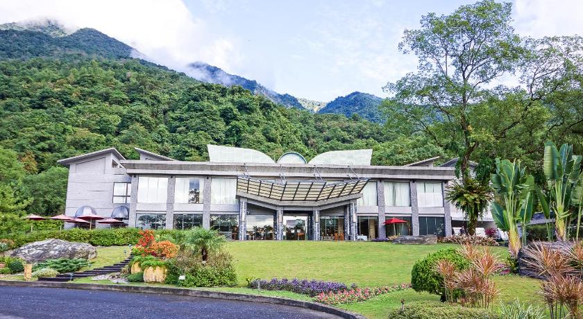 a large house with a large window overlooking a forest, Butterfly Valley Resort in Hualien