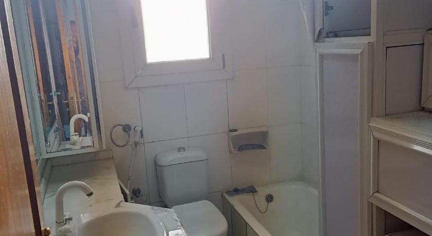a bathroom with a sink and a mirror, Panorama Sea View Apartment - Stanley - Parking - Wi-Fi in Alexandria