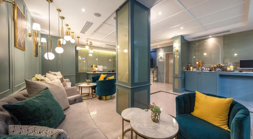 a living room filled with furniture and decor, The Mulberry Bangkok Khaosan Road in Bangkok