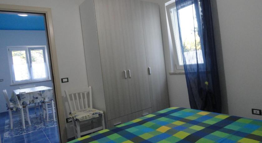 a bedroom with a bed and a window, Cavadozza in Ponza Island