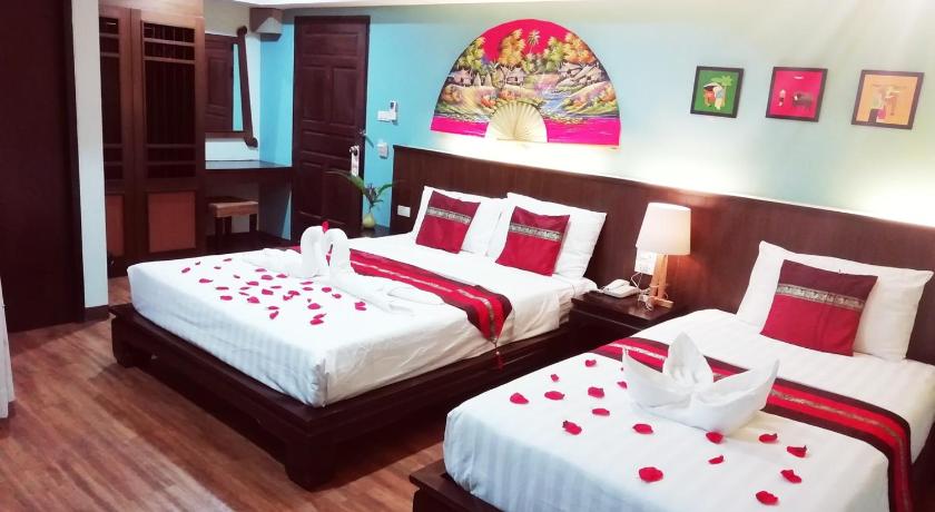 a hotel room with two beds and two lamps, Mandala House in Chiang Mai