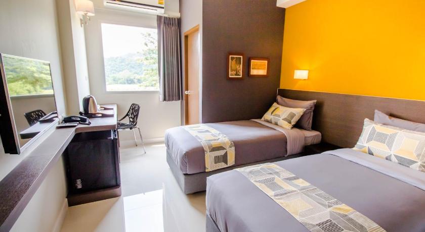 a hotel room with two beds and a television, Fortune D Loei Hotel (SHA Certified) in Loei