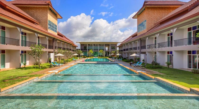 a large swimming pool in front of a building, Southern Airport Hotel (SHA Plus+) in Hat Yai