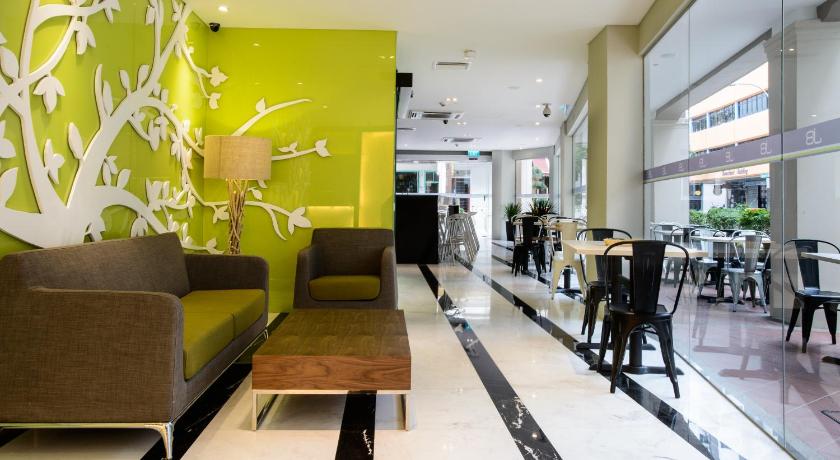 a living room filled with furniture and a large window, J8 Hotel (SG Clean Certified) in Singapore