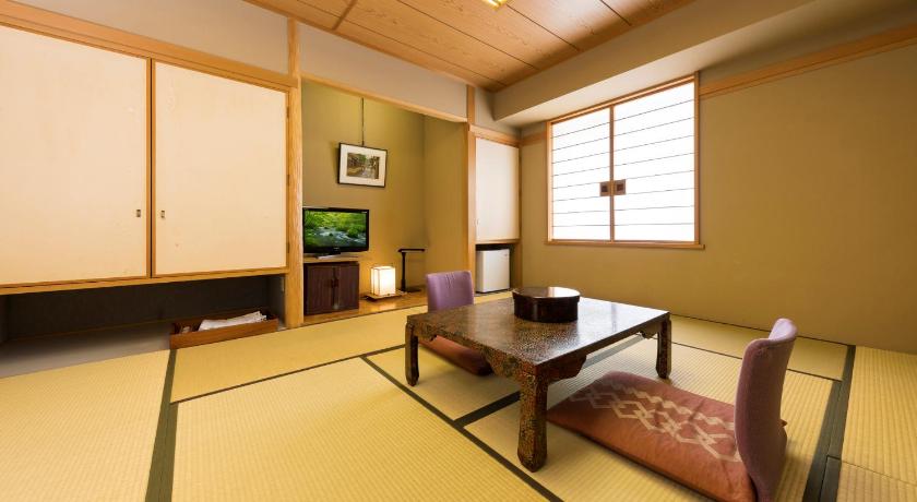 a living room filled with furniture and a table, Hotel Aomori in Aomori