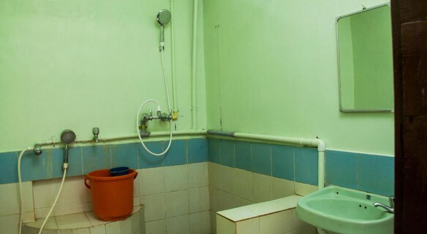 a bathroom with a toilet and a sink, Sharnga Guest House in Pondicherry