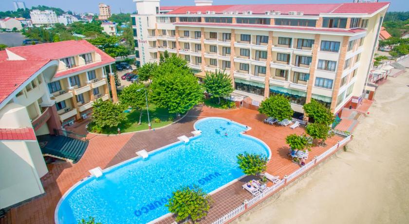 a large building with a pool of water in front of it, Vung Tau Intourco Resort in Vung Tau