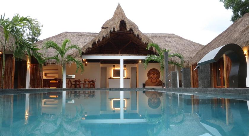 a large swimming pool with a large balcony, SAMADHI Resort & Hydrospa Panglao in Bohol