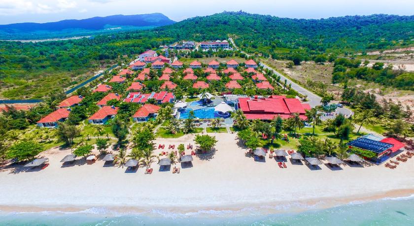a beach filled with lots of colorful umbrellas, Mercury Phu Quoc Resort and Villas in Phu Quoc Island
