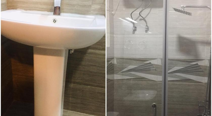 a bathroom with a sink and a shower, Ashley Apartments Rental Services in Nuwara Eliya