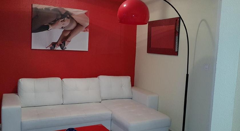 a living room with a couch and a lamp, Cap d'Agde Naturiste Heliopolis F61 vue mer in Agde