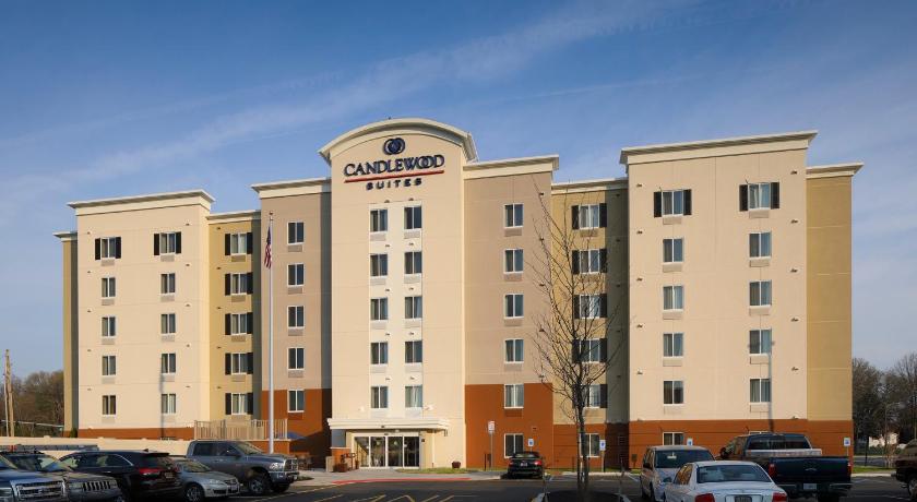 a large building with a large clock on the front of it, Candlewood Suites Newark South - University Area in Newark (DE)