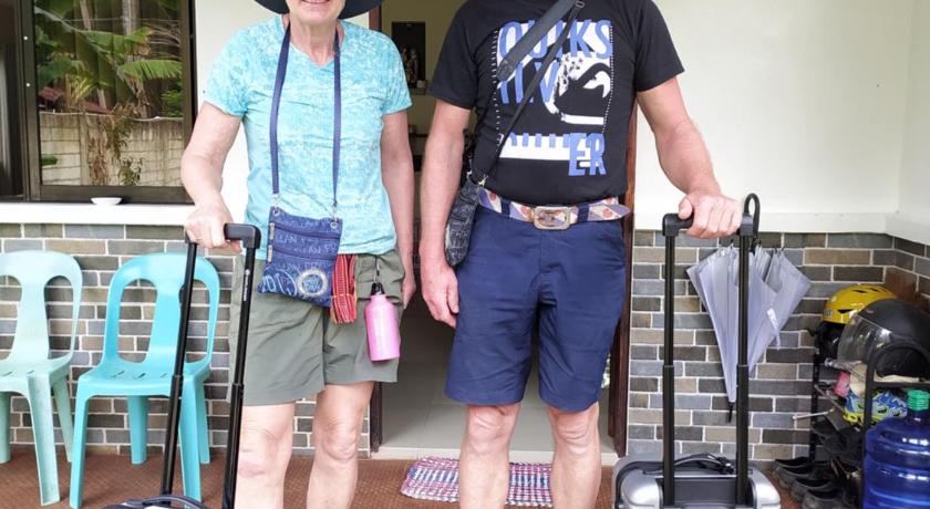 two men standing next to each other with luggage, BOHOL SWEET HOME BED AND BREAKFAST in Bohol