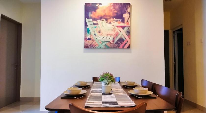 a dining room table with two chairs and a picture on the wall, i-HOME 002 Zetapark @ Setapak Central Mall - 3 Bedroom Family Suite in Kuala Lumpur