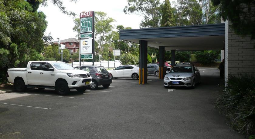 a car parked in front of a gas station, Parramatta City Motel in Sydney