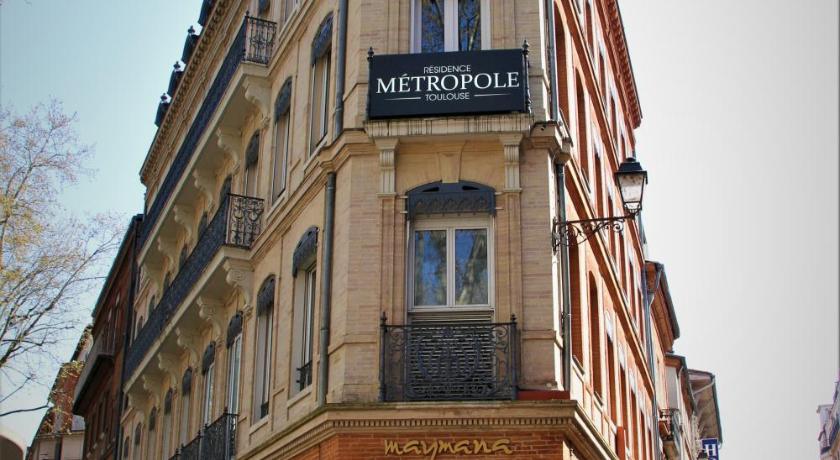 a building with a sign on the side of it, Residence Metropole Toulouse in Toulouse