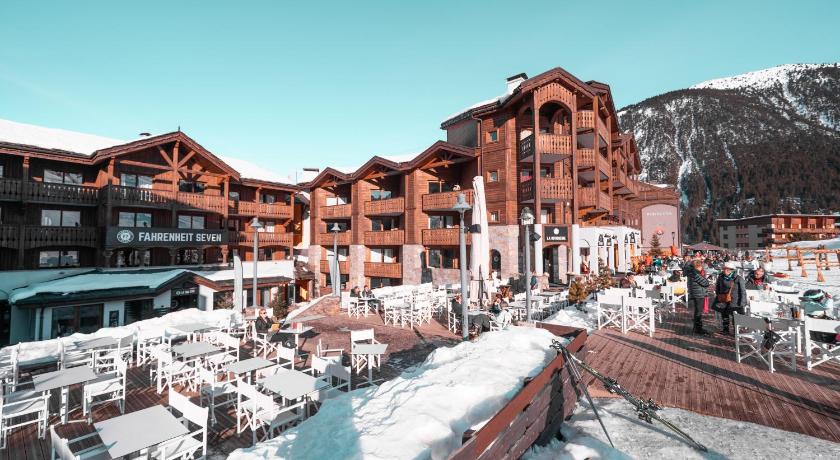 a large building with a lot of snow on top of it, Fahrenheit Seven Courchevel in Saint-Bon-Tarentaise