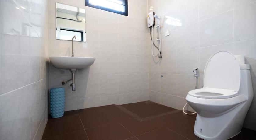 a bathroom with a toilet and a shower stall, INN MY PLACE in Khao Yai