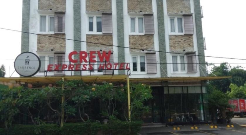 a large building with a clock on the side of it, CREW EXPRESS Hotel in Deli Serdang
