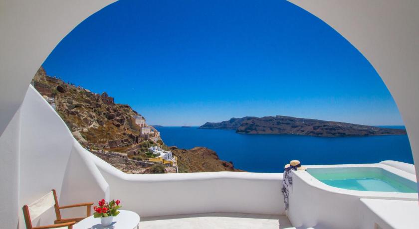a view from a balcony of a boat with a view of the ocean, Oia Mare Villas in Santorini