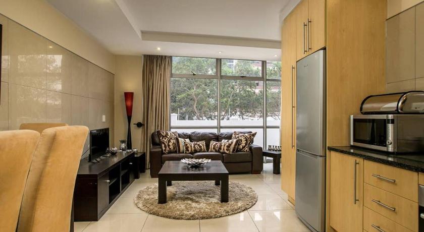 a living room filled with furniture and appliances, Sandton Executive Suites Hydro Park in Johannesburg