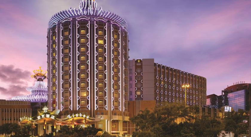 a large building with a clock on top of it, Hotel Lisboa in Macau