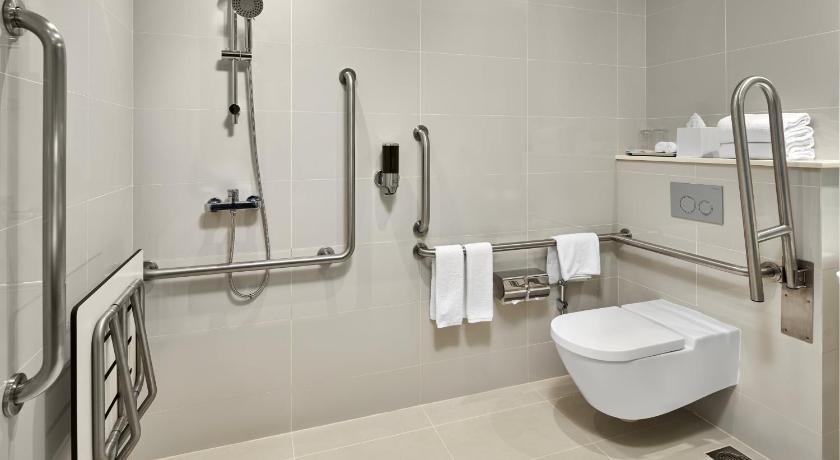 a bathroom with a toilet, bathtub, and shower stall, Holiday Inn Express Singapore Katong (SG Clean Certified) in Singapore