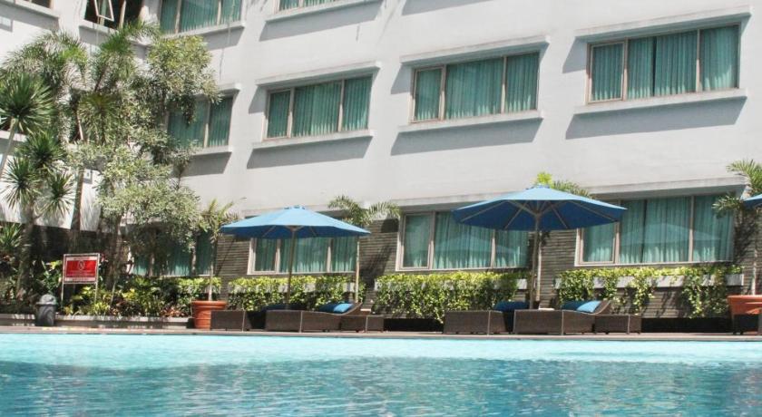 a hotel room with a large swimming pool, Aston Tropicana Hotel Bandung in Bandung