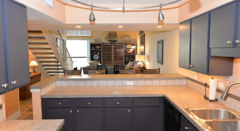 a kitchen with a sink, stove, refrigerator and cabinets, The Mainsail Resort in Destin (FL)