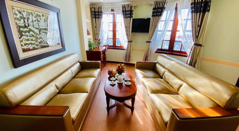 a living room filled with furniture and a window, Ninh Kieu 2 Hotel in Cần Thơ