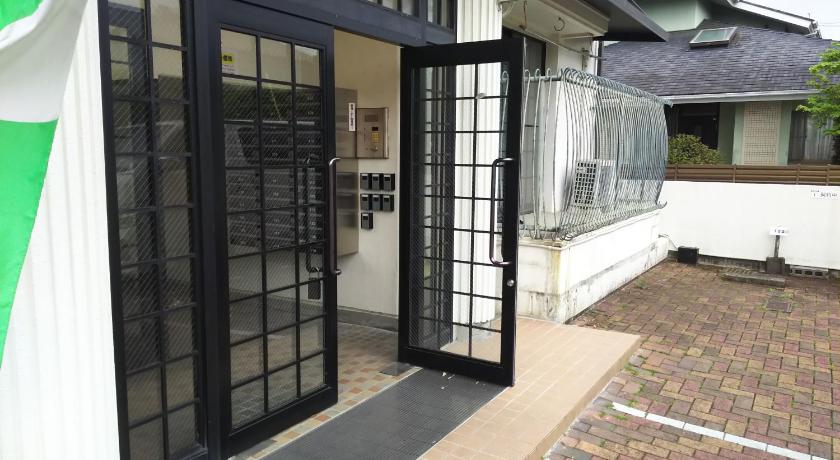 a door that is open in front of a house, Comfort CUBE PHOENIX S Kumamoto in Kumamoto