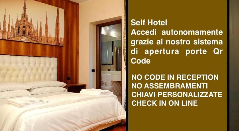 a hotel room with a bed and a desk, Hotel Malpensafiera in Bernate Ticino