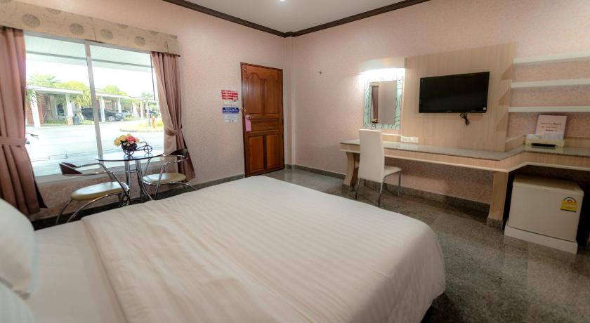 a hotel room with two beds and a television, Martina Hotel (SHA Extra Plus) in Surin