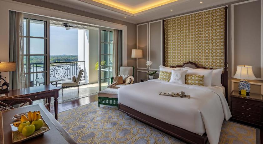 a hotel room with a large bed and a large window, Mia Saigon - luxury boutique hotel in Ho Chi Minh City