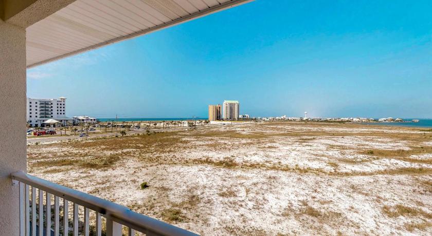 a beach with a lighthouse and a boat on it, Gulf Island Condos in Pensacola Beach (FL)