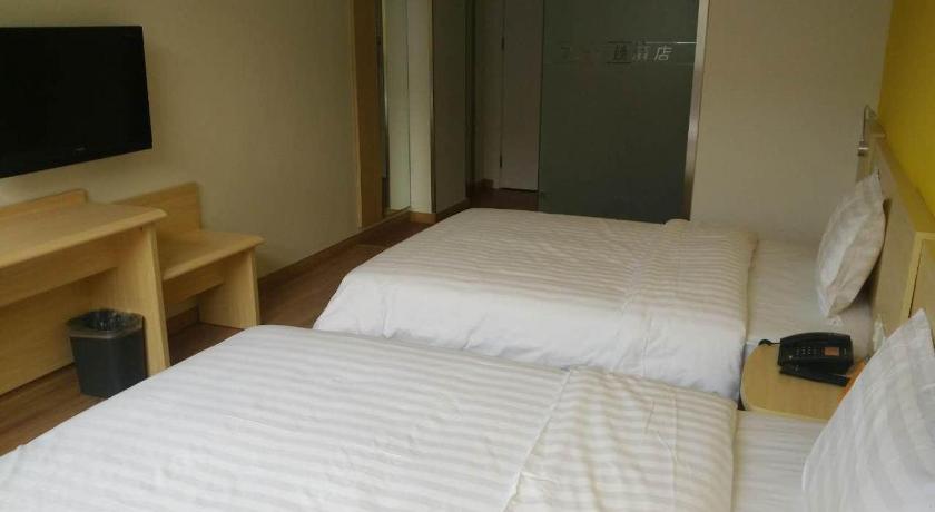 a hotel room with a bed and a television, 7 Days Inn Beijing Haidian Shangzhuang Branch in Beijing