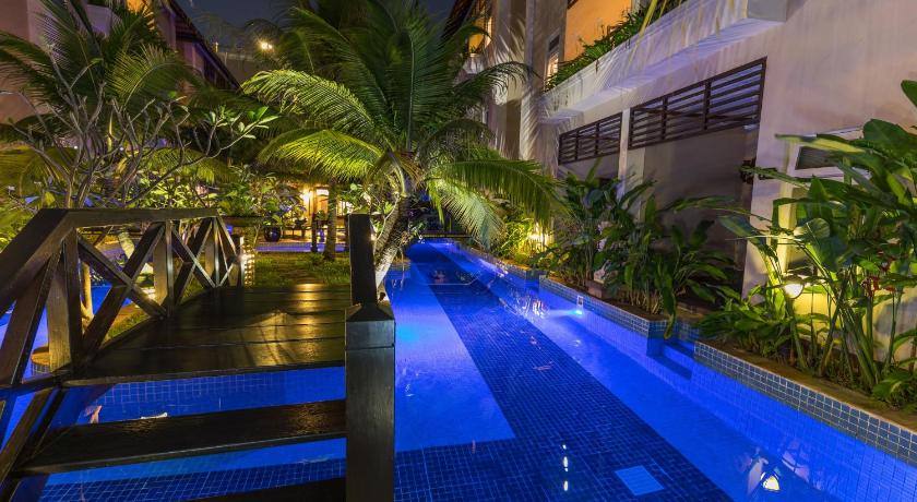 a large swimming pool in a large building, Bali Hotel in Phnom Penh