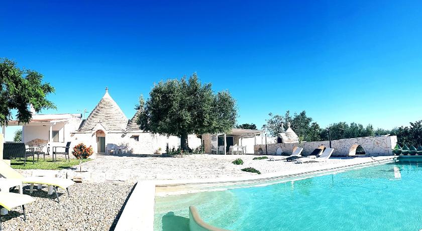 a beach with a pool and a pool table, Casa Relax Isabelle in Monopoli