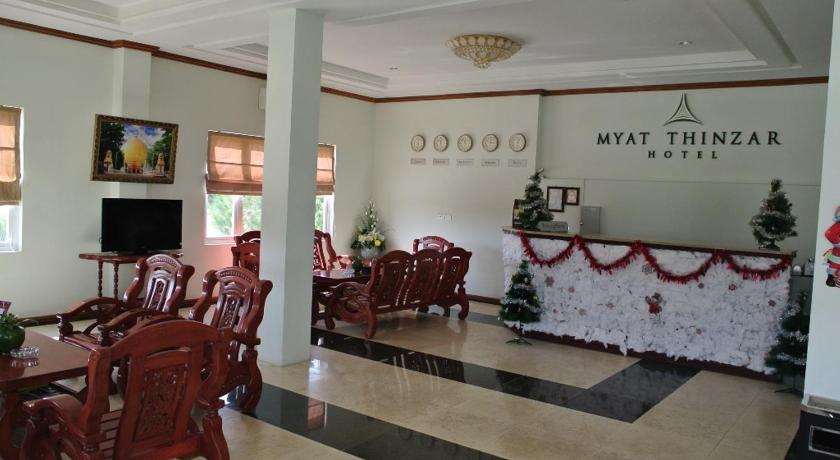 a living room filled with tables and chairs, Myat Thinzar Hotel in Nay Pyi Taw