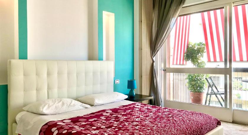 a bedroom with a bed and a window, ROOM 110 BARI -guesthouse- in Bari