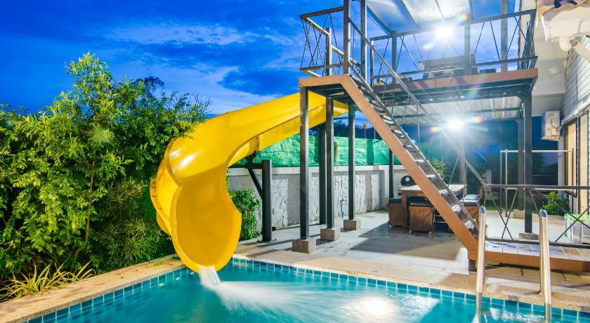 a yellow swimming pool with a yellow surfboard in it, Sierra Villa 102 in Hua Hin / Cha-am