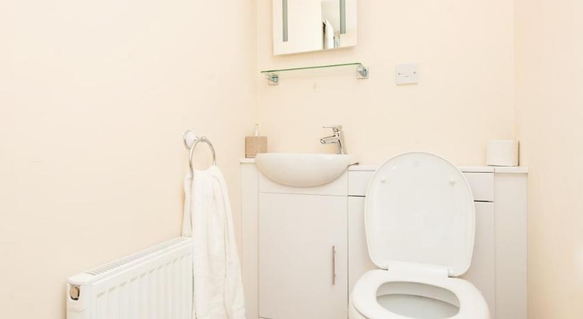a white toilet sitting in a bathroom next to a sink, Callander Hostel in Callander