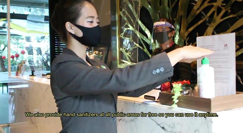 a woman cutting a cake in a kitchen, Swiss-Belresidences Kalibata in Jakarta