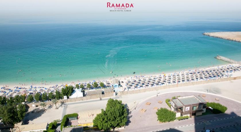 a beach scene with a large body of water, Ramada by Wyndham Beach Hotel Ajman in Ajman