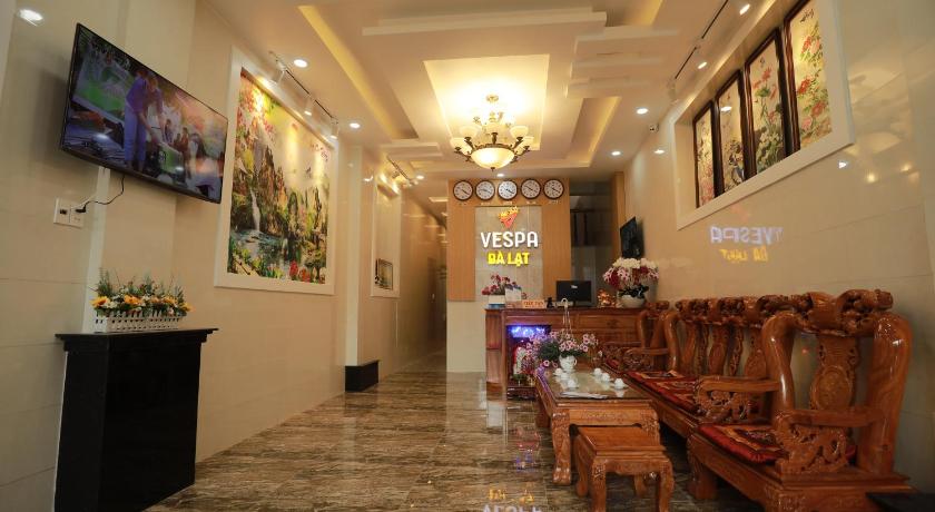 a living room filled with furniture and a tv, VES - PA Luxury Hotel in Dalat