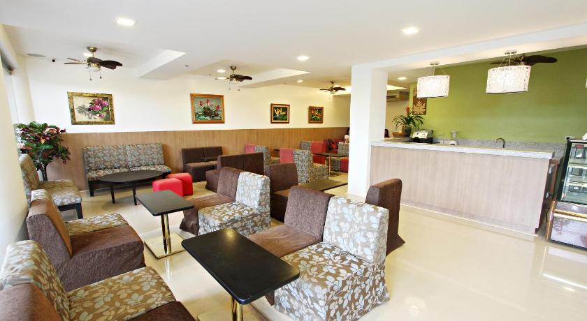 a living room filled with furniture and a large window, Hotel Fleuris Palawan in Palawan