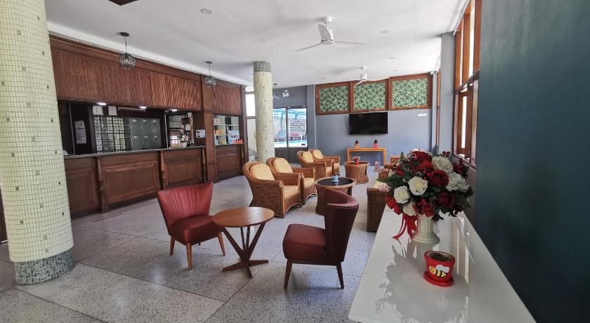 a living room filled with furniture and a kitchen, Subhamitra Hotel Hua Hin (SHA Certified) in Hua Hin / Cha-am