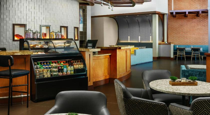 a kitchen with a table, chairs, and tables, Hyatt Place Ft Lauderdale Airport Cruise Port in Fort Lauderdale (FL)