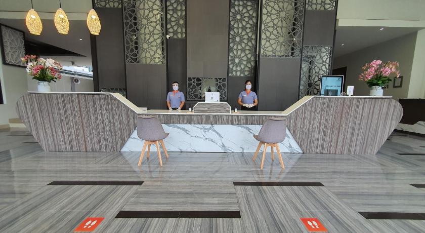 two women sitting on couches in a living room, ZENSEANA Resort & Spa (SHA Extra Plus) in Phuket