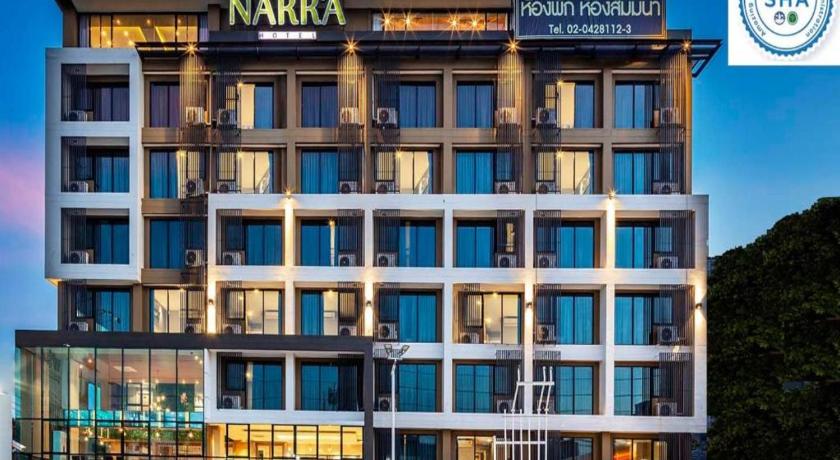 a large building with a clock on the front of it, Narra hotel in Bangkok